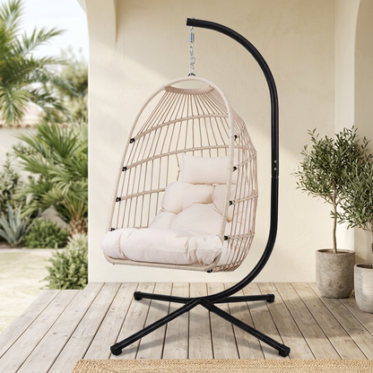 Beige hanging egg chair on a covered porch